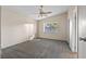 A neutral main bedroom features vaulted ceilings, a window and neutral carpet at 6217 Sadler Dr, Las Vegas, NV 89130