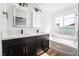 Beautiful bathroom with marble countertop, tub and a dual sink vanity at 6505 Moon Roses Ct, Las Vegas, NV 89108