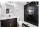 Updated bathroom featuring a marble vanity, stylish black herringbone tile in shower, and modern fixtures at 6505 Moon Roses Ct, Las Vegas, NV 89108