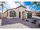 Well-maintained home with a gravel yard and a black door and garage door at 6505 Moon Roses Ct, Las Vegas, NV 89108