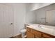 Bathroom featuring a vanity with a mirror, a toilet, and white fixtures at 74 Harbor Coast St, Las Vegas, NV 89148