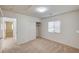 A bright bedroom with neutral carpet, a window with blinds, and closet space at 74 Harbor Coast St, Las Vegas, NV 89148