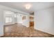 Bright, open living room featuring neutral walls and beautiful tile flooring throughout the entryway and into the kitchen at 74 Harbor Coast St, Las Vegas, NV 89148