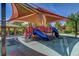 Shaded community playground with slides and climbing structures, offering safe and fun outdoor recreation at 74 Harbor Coast St, Las Vegas, NV 89148