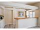 A cute bar area with light wood counter, sink, and recessed lighting provides a welcoming space for relaxation and entertaining at 7623 Calm Passage Ct, Las Vegas, NV 89139