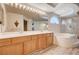 Bright bathroom with double sinks, soaking tub, and walk-in shower at 7623 Calm Passage Ct, Las Vegas, NV 89139