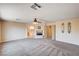 Large bedroom with fireplace, ceiling fan, and access to the Primary bath at 7623 Calm Passage Ct, Las Vegas, NV 89139