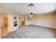 Bright and spacious bedroom featuring a fireplace, ceiling fan and carpet floors at 7623 Calm Passage Ct, Las Vegas, NV 89139