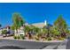 Two-story home with lush landscaping, including mature palm trees, offering great curb appeal at 7623 Calm Passage Ct, Las Vegas, NV 89139