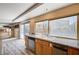 Kitchen area with double sink, stainless steel appliances, granite counters and backyard views at 7623 Calm Passage Ct, Las Vegas, NV 89139