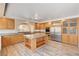 Modern kitchen features an island, stainless appliances and plenty of counter space at 7623 Calm Passage Ct, Las Vegas, NV 89139