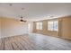 Spacious living room with hardwood floors and natural light from windows at 7623 Calm Passage Ct, Las Vegas, NV 89139