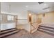 Carpeted stairs with wood railing lead to a bright landing at 7623 Calm Passage Ct, Las Vegas, NV 89139