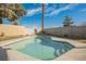 A refreshing pool is surrounded by a well-kept yard and privacy walls, perfect for outdoor entertaining at 764 Biaritz Ave, Las Vegas, NV 89123