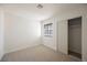 Bedroom with carpet, window, and mirrored closet at 764 Biaritz Ave, Las Vegas, NV 89123