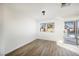 Bright bedroom with light-colored floors and sliding doors to the pool area at 764 Biaritz Ave, Las Vegas, NV 89123