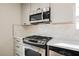 A well-equipped kitchen features stainless steel appliances and white subway tile backsplash at 764 Biaritz Ave, Las Vegas, NV 89123