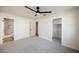 Spacious main bedroom featuring a ceiling fan and ensuite bathroom with walk-in closet at 764 Biaritz Ave, Las Vegas, NV 89123