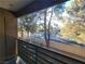 Balcony provides a serene outdoor space with views of trees and foliage at 7730 Secret Shore Dr # 207, Las Vegas, NV 89128