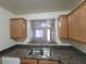 Kitchen sink with stainless steel faucet and brown granite countertop at 7730 Secret Shore Dr # 207, Las Vegas, NV 89128