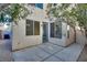 Back patio space surrounded by foliage, with a mix of concrete and gravel at 7978 Light Tower St, Las Vegas, NV 89139