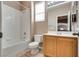 Bathroom featuring a single vanity and a shower-tub combination with tiled walls at 7978 Light Tower St, Las Vegas, NV 89139