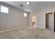 Serene bedroom with neutral walls, plush carpeting, and a connected bathroom entrance at 7978 Light Tower St, Las Vegas, NV 89139