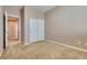 Bedroom with closet, neutral walls, carpet, and hallway view at 7978 Light Tower St, Las Vegas, NV 89139