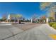 Community entrance with brick pillars and iron gates, set in a well-manicured neighborhood at 7978 Light Tower St, Las Vegas, NV 89139