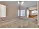 Bright and airy living room with neutral walls, carpeting, and abundant natural light at 7978 Light Tower St, Las Vegas, NV 89139