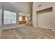 Spacious living room featuring neutral tones, plush carpeting, and bright natural light at 7978 Light Tower St, Las Vegas, NV 89139