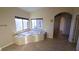 Bright bathroom features a garden tub with decorative trim, tile flooring, and a window at 8223 Saddleback Ledge Ave, Las Vegas, NV 89147