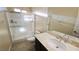 The bathroom features a shower stall, toilet, sink and a mirrored wall at 8223 Saddleback Ledge Ave, Las Vegas, NV 89147