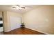 Comfortable bedroom showcasing wood floors, a ceiling fan, and ample closet space at 8223 Saddleback Ledge Ave, Las Vegas, NV 89147