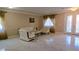 A bright living room with tile floors and a formal sitting area at 8223 Saddleback Ledge Ave, Las Vegas, NV 89147