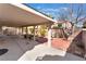 Large covered patio with outdoor furniture and a view of the landscaped backyard at 8520 Copper Falls Ave, Las Vegas, NV 89129