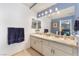 Bright bathroom featuring a double vanity with granite countertops and modern lighting fixtures at 8520 Copper Falls Ave, Las Vegas, NV 89129