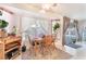 Dining area featuring a window with natural light, a ceiling fan, and tile flooring at 8520 Copper Falls Ave, Las Vegas, NV 89129