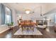 Dining room with a decorative chandelier, a fireplace, and wood floors at 8520 Copper Falls Ave, Las Vegas, NV 89129