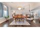 Dining room with a decorative chandelier, a fireplace, and wood floors at 8520 Copper Falls Ave, Las Vegas, NV 89129