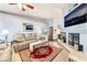 Inviting living room with tile floors, neutral walls, fireplace, and comfortable seating at 8520 Copper Falls Ave, Las Vegas, NV 89129