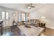 Inviting living room with a stylish ceiling fan and abundant natural light at 8520 Copper Falls Ave, Las Vegas, NV 89129