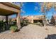 A cozy patio and desert landscaping create a relaxing outdoor space at 8808 Litchfield Ave, Las Vegas, NV 89134