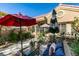 Inviting front courtyard featuring patio furniture and lush landscaping offering a tranquil outdoor living space at 8808 Litchfield Ave, Las Vegas, NV 89134