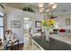 Bright dining area with a view into the kitchen and a stylish, rustic table setting at 8808 Litchfield Ave, Las Vegas, NV 89134