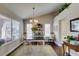 Bright dining room with a stylish table, decorative accents, and large windows at 8808 Litchfield Ave, Las Vegas, NV 89134