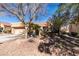 Landscaped front yard with decorative rock and native plantings, adding curb appeal to this charming home at 8808 Litchfield Ave, Las Vegas, NV 89134