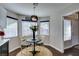 Cozy kitchen nook with modern pendant lighting, breakfast table and a view into the kitchen at 8808 Litchfield Ave, Las Vegas, NV 89134