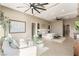 Well-lit main bedroom with sitting area and view of city lights at 9 Stonecutter Ct, Henderson, NV 89012