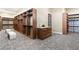 Large walk-in closet with built-in organizers, shelving, and luxurious seating at 9 Stonecutter Ct, Henderson, NV 89012